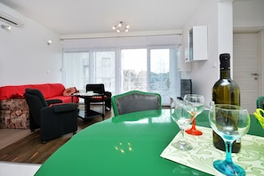 Apartment, 2 Bedrooms | Living area | Flat-screen TV