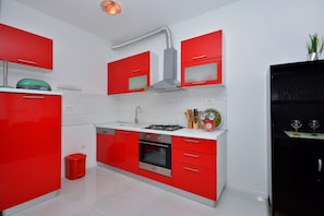 Enjoy cooking in this well-organized kitchen with a microwave, oven, and gas stove.