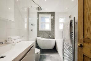 Combined shower/bathtub, hair dryer, towels, soap