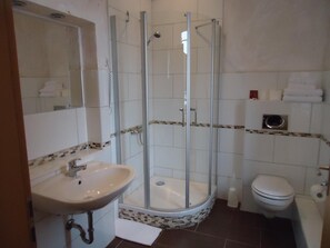 Shower, designer toiletries, towels