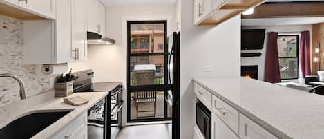Condo, 2 Bedrooms | Private kitchen | Fridge, microwave, oven, dishwasher