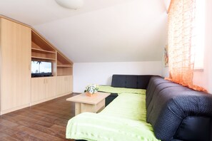 Apartment, 2 Bedrooms (C3) | Living area | Flat-screen TV