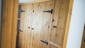 A wooden door with a simple latch mechanism. - Abbey Place Net Loft (Penzance)