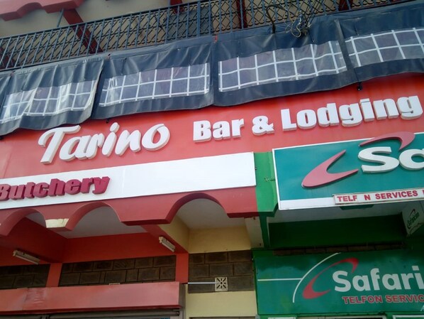 A storefront with signs for 'Tarino Bar & Lodging' and 'Butchery'. - Tarino Bar And Lodging (Kitengela)