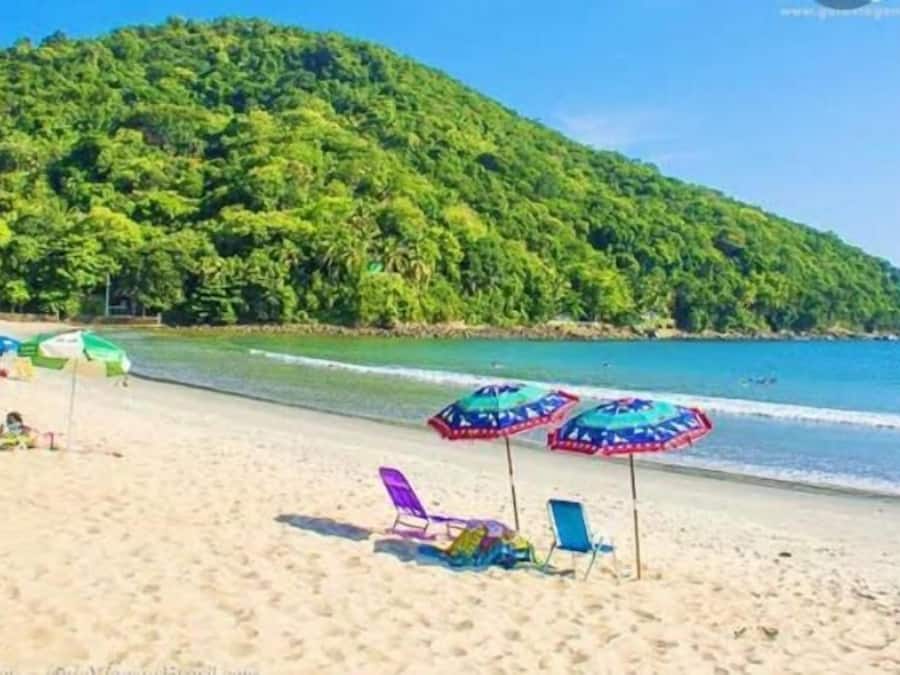 Beach nearby, white sand, beach umbrellas, beach towels
