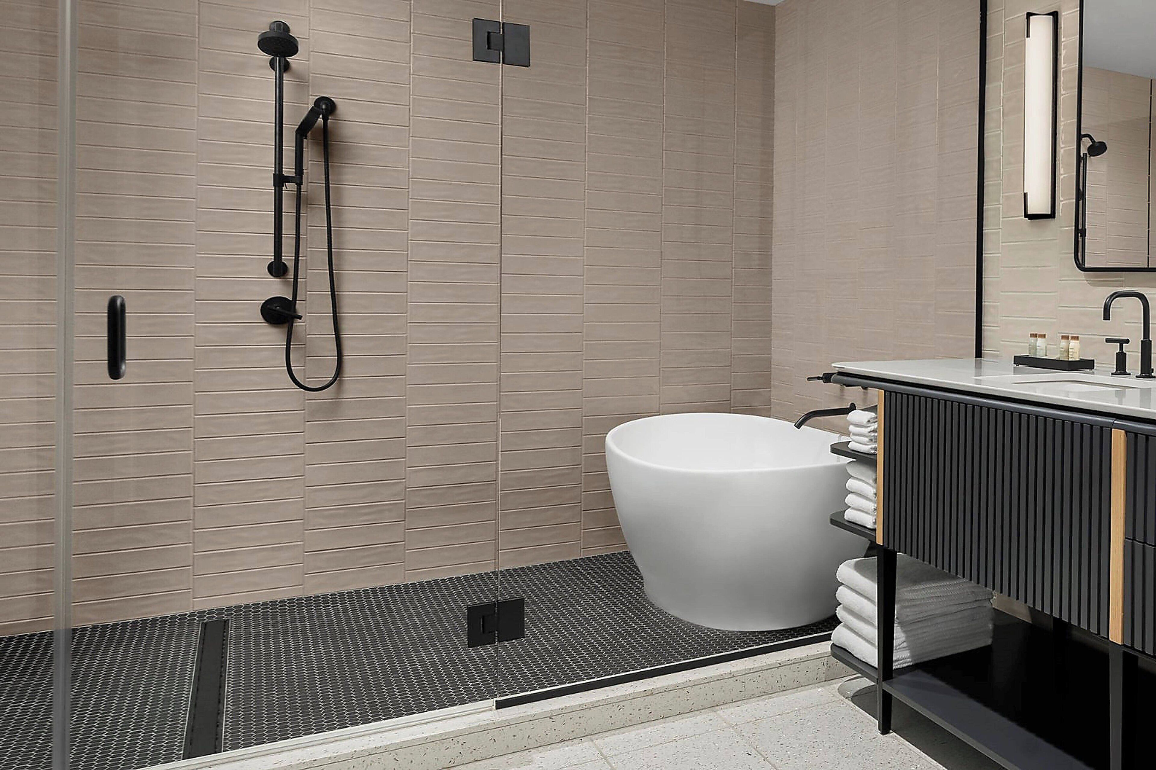 designer toiletries, hair dryer, bathrobes, slippers