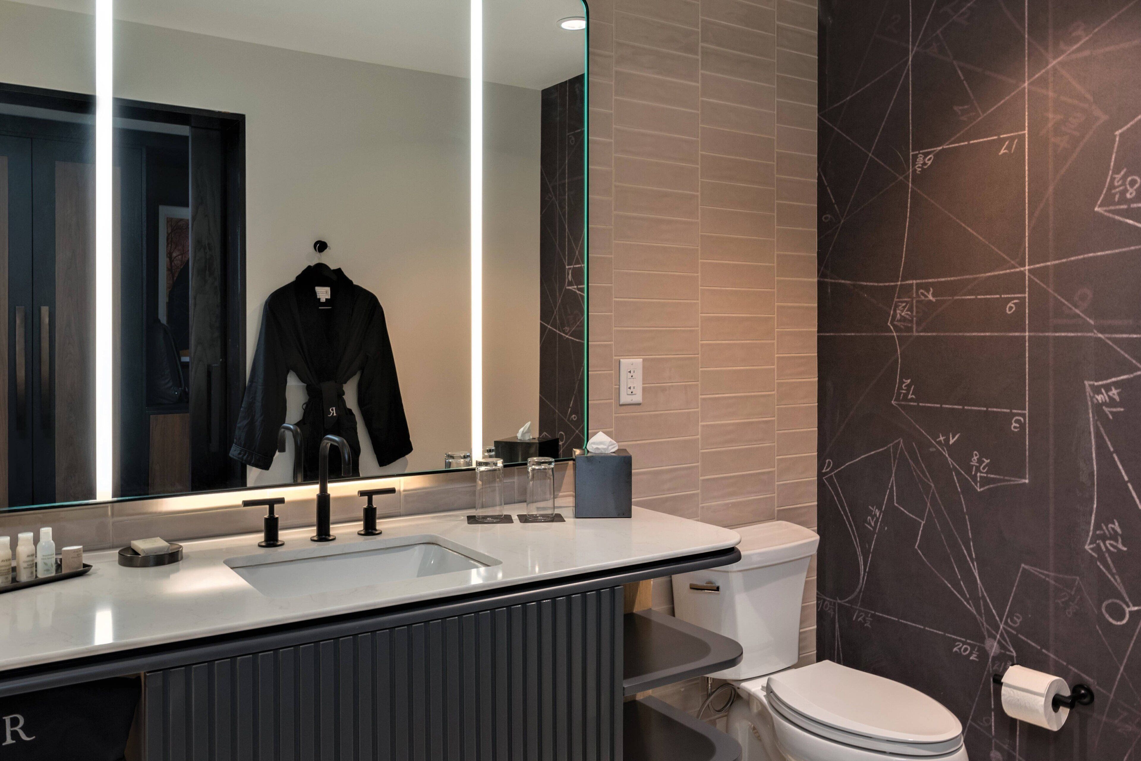 designer toiletries, hair dryer, bathrobes, slippers