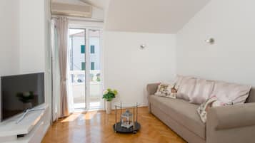 Appartement, 1 slaapkamer | Verduisterende gordijnen, geluiddichte muren