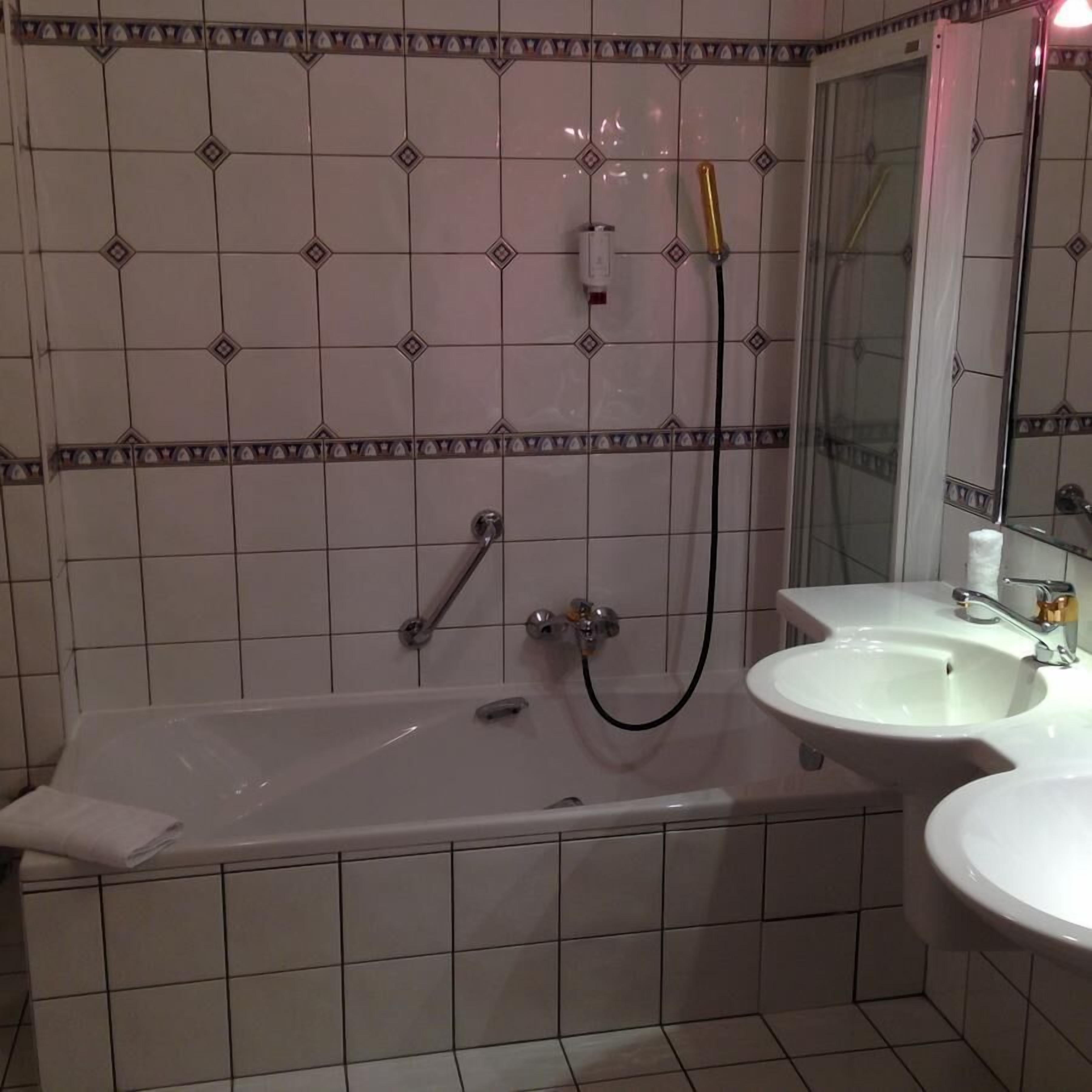 double room, bathtub | bathroom | hair dryer, towels, toilet paper