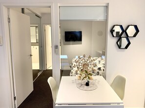 1 bedroom, desk, iron/ironing board, travel crib