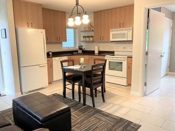 Full-sized fridge, microwave, oven, dishwasher - Charming 1-bedroom condo with water views in vibrant downtown Saugatuck. (Saugatuck)