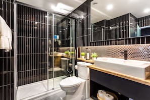 Shower, rainfall showerhead, hair dryer, towels