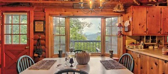 Mountaintop log cabin w/ wood stove hot tub and grill near Lake Chatuge