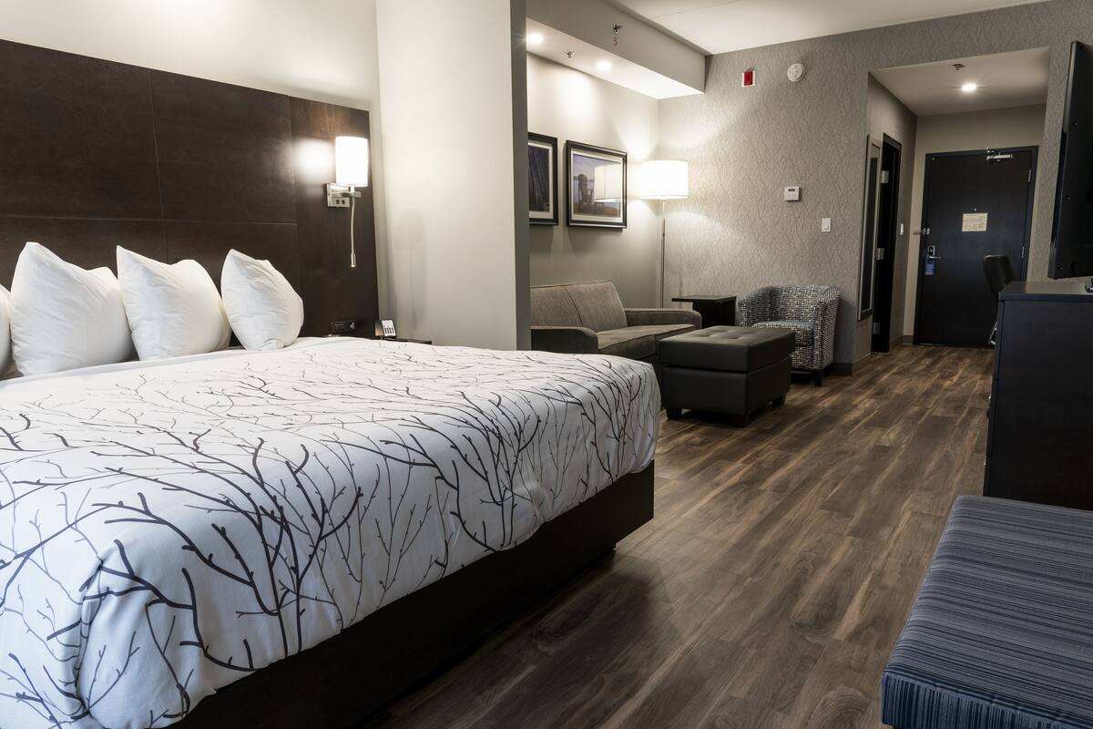 suite, 1 king bed, non smoking, refrigerator & microwave | living area | 55-inch flat-screen tv with cable channels, tv