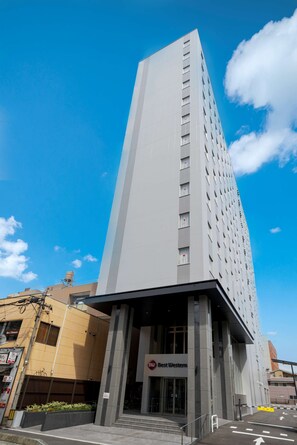 A tall, modern building with a prominent entrance labeled "Best Western." - Best Western Plus Fukuoka Tenjin-minami (Fukuoka)