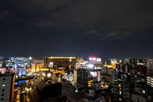 A nighttime cityscape with illuminated buildings and a prominent billboard. - Best Western Plus Fukuoka Tenjin-minami (Fukuoka)