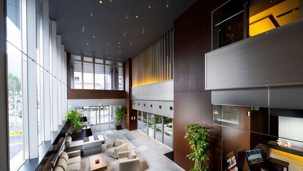 A spacious lobby with seating areas, large windows, and a reception desk. - Best Western Plus Fukuoka Tenjin-minami (Fukuoka)