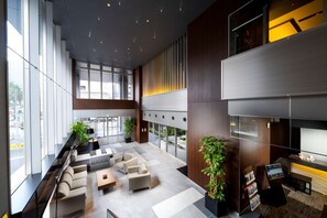 A spacious lobby with seating areas, large windows, and a reception desk. - Best Western Plus Fukuoka Tenjin-minami (Fukuoka)
