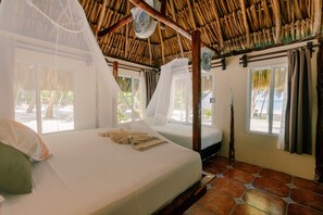 Huisje, privébadkamer, uitzicht op het strand | Beddengoed