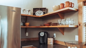 A kitchen with wooden shelves, a coffee maker, and a basket of eggs. - 1- Bedroom 1- Bathroom Ranch Guest house. (Ellensburg)