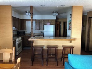 Enjoy cooking in this well-equipped kitchen with a central island and stainless steel appliances.