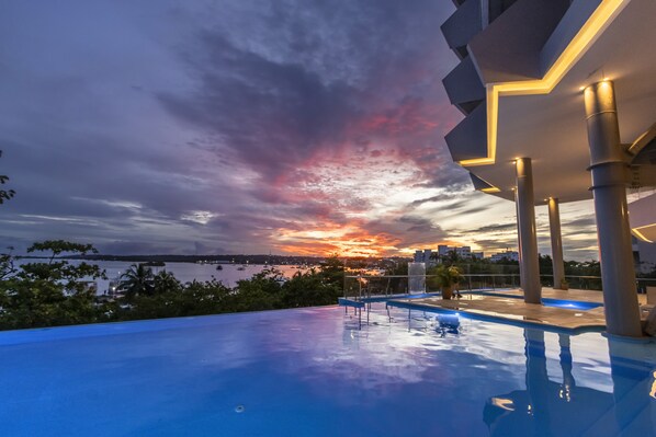 Outdoor pool, open 8:00 AM to 6:00 PM, pool umbrellas, pool loungers