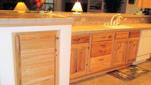 A kitchen with wooden cabinets, a sink, and a countertop. - Pinetop Country Club Hand Haven (Pinetop)