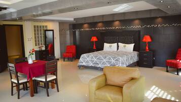 Luxury Suite, 2 Bedrooms, Corner | Down comforters, iron/ironing board, free WiFi