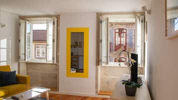 One-Bedroom apartment, street view (Alegria) | Living area | 60-cm flat-screen TV with cable channels, TV