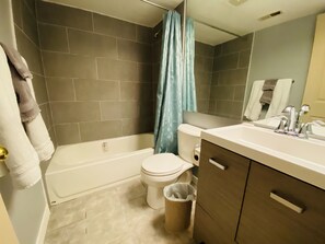 Combined shower/bathtub, hair dryer, towels, toilet paper - Clean & Cozy One Bedroom Condo W/ Kitchen In DTC (Greenwood Village)