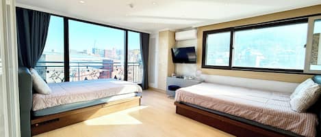 Deluxe Studio, 2 Queen Beds | Pillow-top beds, individually decorated, individually furnished