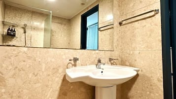 Deluxe Studio, 2 Queen Beds | Bathroom | Shower, hair dryer, slippers, towels