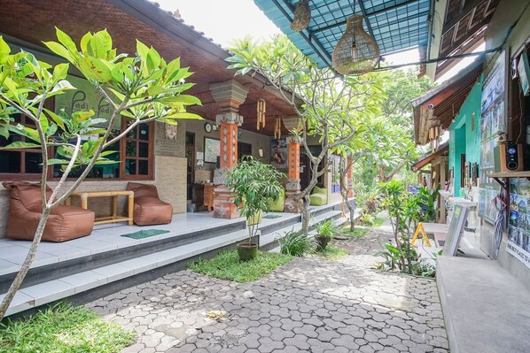 Relax in a serene courtyard with a paved walkway, steps, and seating areas.