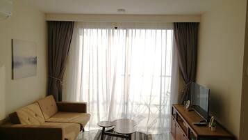 Apartment, 2 Bedrooms, Balcony, Sea View | Living room | 40-inch flat-screen TV with cable channels, TV