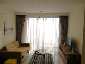 Apartment, 2 Bedrooms, Balcony, Sea View | Living room | 40-inch flat-screen TV with cable channels, TV - Timurbay by SMC Homes (Kuantan)