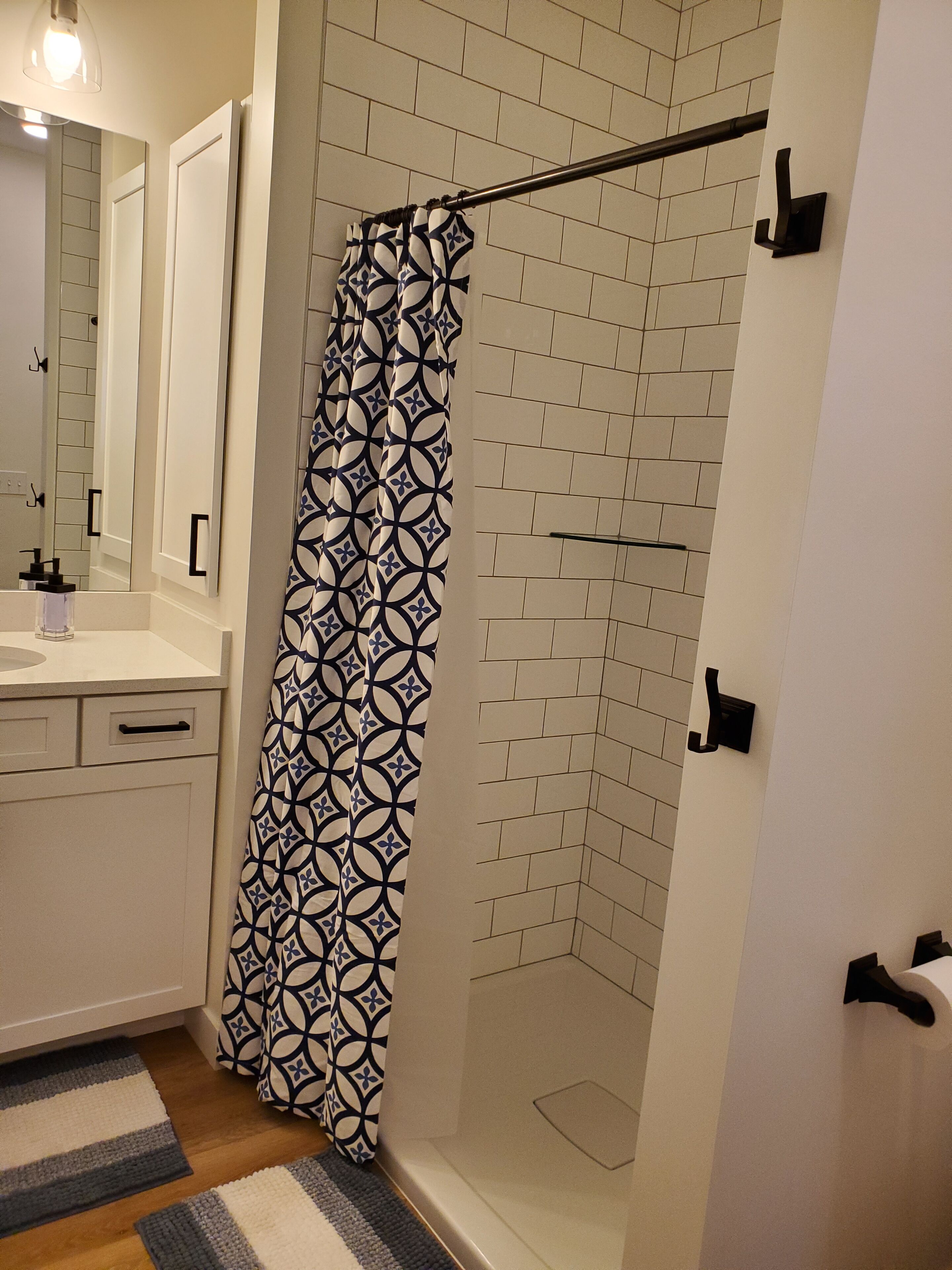 Shower, hair dryer, towels, shampoo