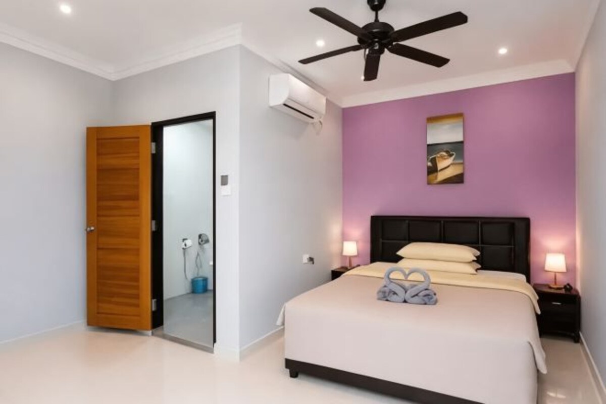 Desk, laptop workspace, blackout drapes, bed sheets
