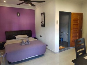 Desk, laptop workspace, blackout curtains, bed sheets