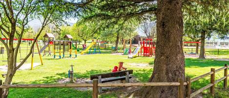 Public Space, Outdoor Play Equipment, Playground Slide, Park, Recreation, Lawn, Shade, Garden, Leisure, Playground