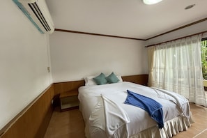 Deluxe Room, Garden View | Minibar, desk, free WiFi, bed sheets