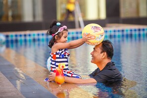 Outdoor pool, open 8:00 AM to 9:00 AM, pool umbrellas, pool loungers