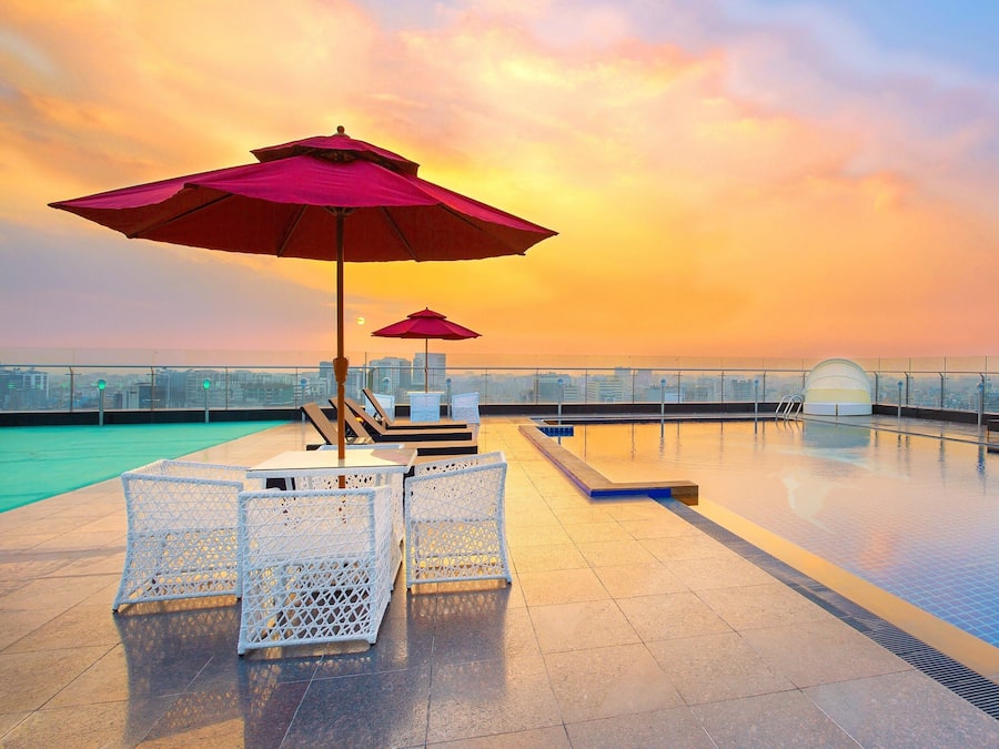 Outdoor pool, open 8:00 AM to 9:00 AM, pool umbrellas, pool loungers