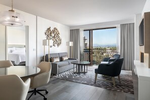 Suite, 1 Bedroom, Theme Park View | Living area | 55-inch LED TV with cable channels, TV, iPod dock