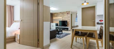 Business Apartment, City View | Living area | 48-inch LCD TV with cable channels, TV