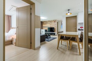 Business Apartment, City View | Living area | 48-inch LCD TV with cable channels, TV