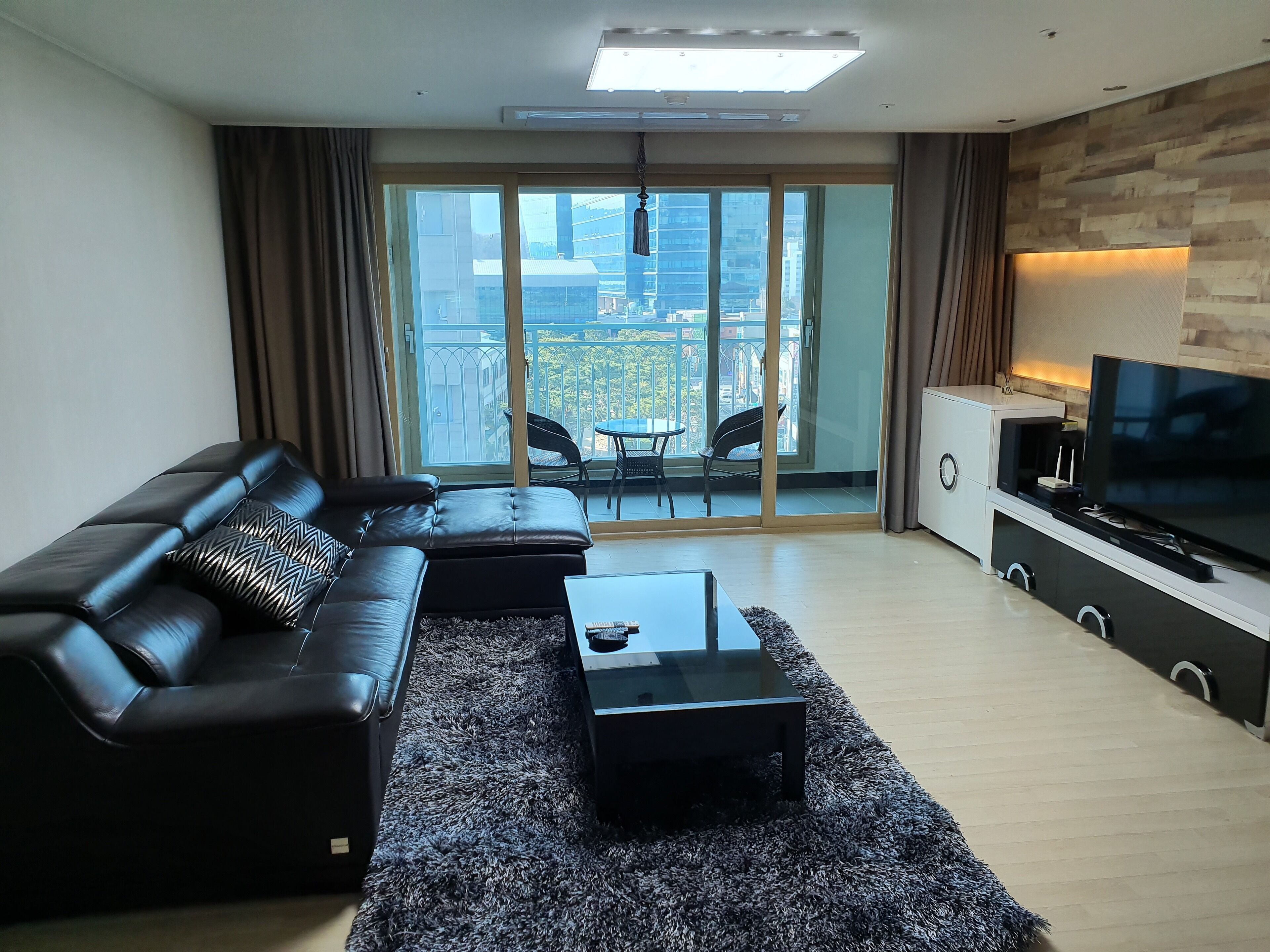 family apartment, city view | living room | 48-inch lcd tv with cable channels, tv