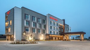 A modern Hampton Inn hotel with a flat facade, multiple windows, and a welcoming entrance. - Hampton Inn Hastings (Hastings)