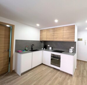 Fridge, microwave, coffee/tea maker, cookware/dishes/utensils