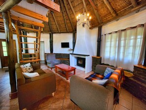 Family Chalet | Living area | 1-cm flat-screen TV with digital channels, TV - Pine Valley Lodge (Lanseria)