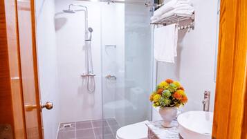 Family Studio | Bathroom | Shower, hair dryer, slippers, towels